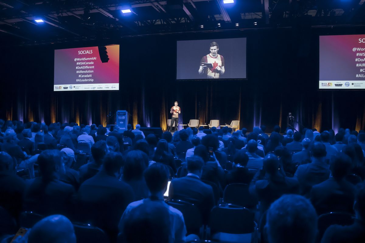 Matthew Blakemore on stage before a full hall at World Summit AI Americas