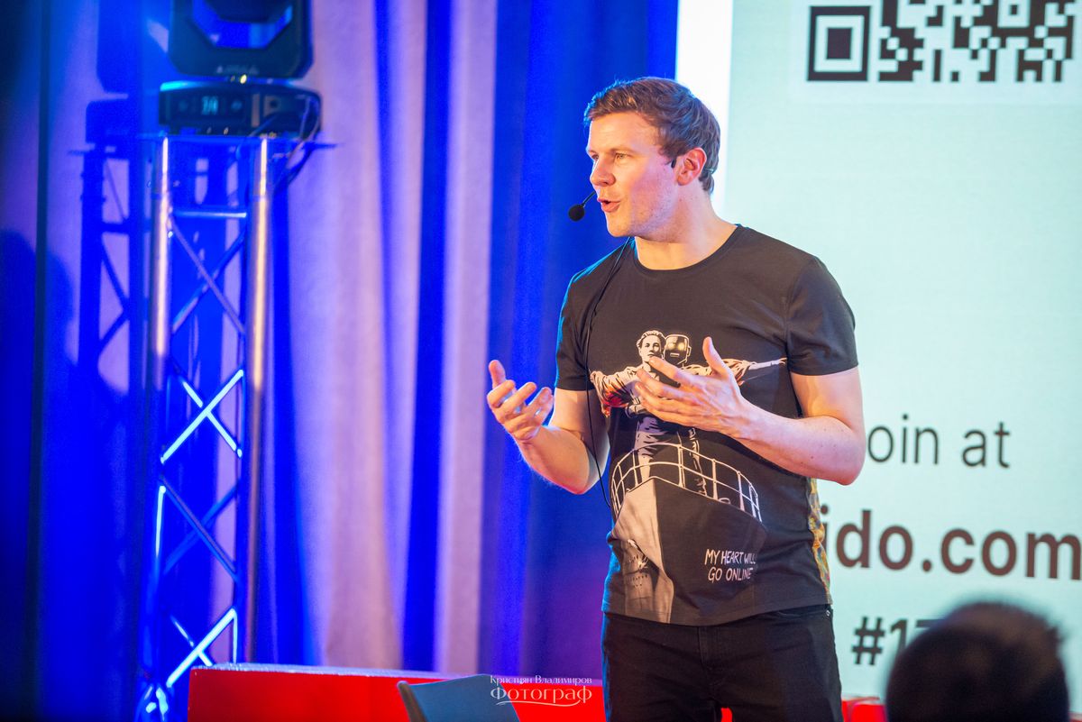 Matthew Blakemore on stage speaking about AI and relationships